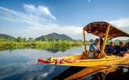 A family takes a Shikara ride at the Dal Lake